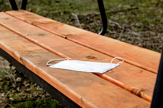 Protective Medical Mask Forgotten On Park Bench