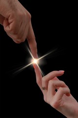 male and female hands touch each other