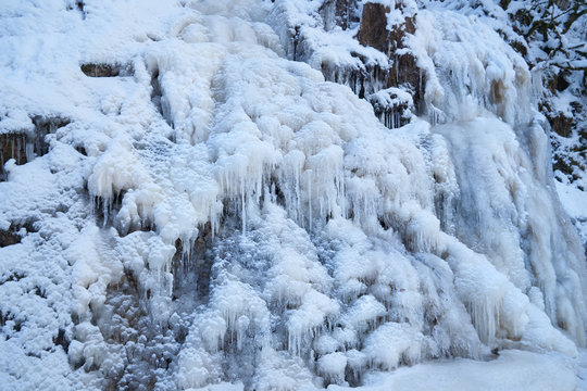 Icy waterfall on a mountain river.