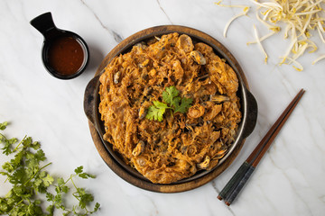 Crispy Fried Mussel Pancake with hot sauce in hot plate