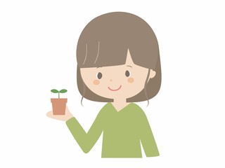 Young woman with seedling