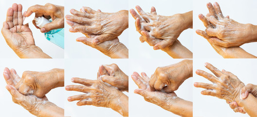 Senior woman's hands washing her hands using soap foam step in step on white background, Close up &...