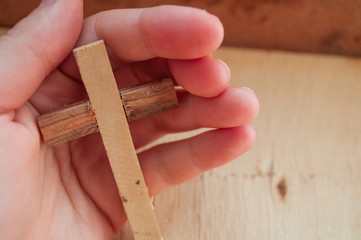 Wooden cross on praying hands, World Day of Prayer, international day of prayer, Easter concept