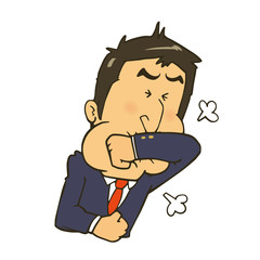 咳を腕で受け止めるスーツの男性