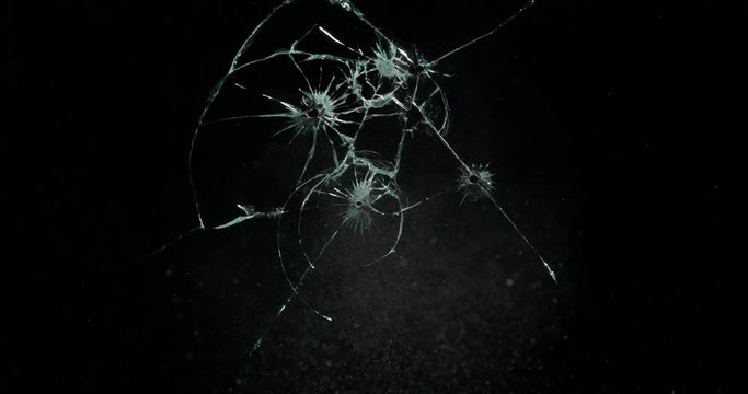 Broken cracks glass fracture effect texture isolated abstract black background. Bullet cracked window with big hole screen mirror weapon shot.
