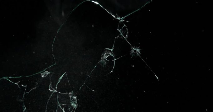Broken cracks glass fracture effect texture isolated abstract black background. Bullet cracked window with big hole screen mirror weapon shot.