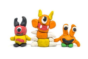 Play dough group monsters on white background. Handmade clay plasticine