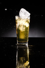 glass of beer on dark background