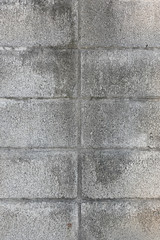 Pattern of grey wall made of concrete bricks