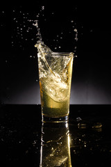 glass of beer on dark background