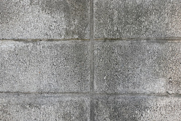 Pattern of grey wall made of concrete bricks