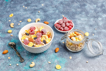 Healthy breakfast. Fresh granola, muesli with nuts and frozen berries. Top view. Copy space.