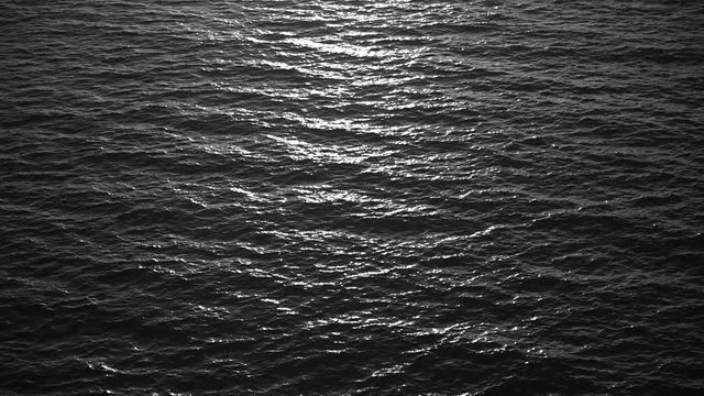 Black and white surface of sea or ocean water.