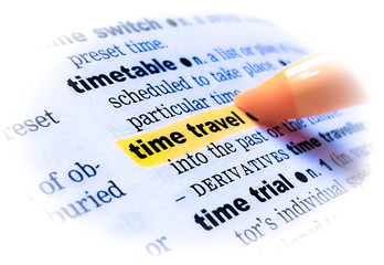 A close up of the word: TIME TRAVEL in a dictionary, highlighted in yellow and showing part of its definition.