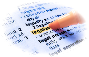 A close up of the word: LEGALIZE in a dictionary, highlighted in yellow and showing part of its...