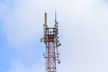 Base station mobile network antenna on a steel structure mast with a repeater.