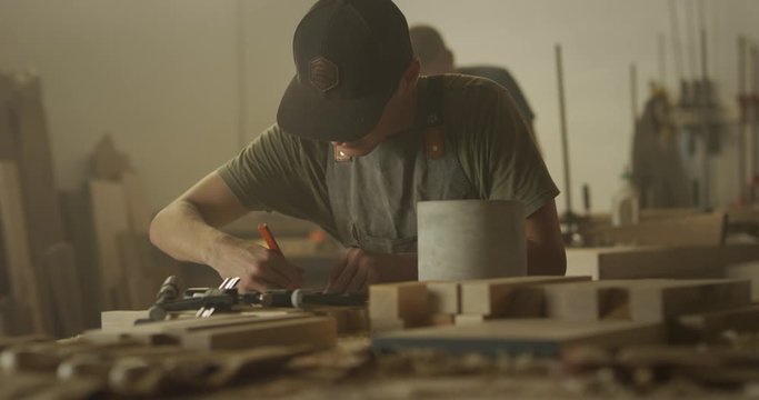 Woodworker man working in garage