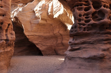 Red canyon in Israel near Eilat. Picturesque and undulating rocks hollowed out by rain in sandstone in the Negev desert.