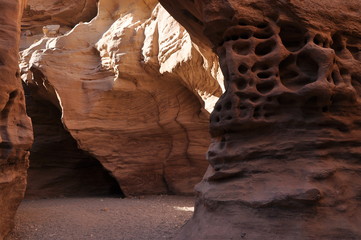 Red canyon in Israel near Eilat. Picturesque and undulating rocks hollowed out by rain in sandstone in the Negev desert.