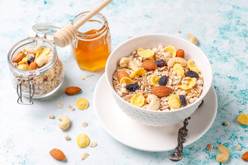 Healthy breakfast. Fresh granola, muesli with nuts and frozen berries. Top view. Copy space.