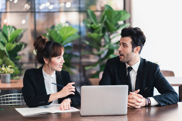 Young asian business group discussion in office workplace. lifestyle social distance friends meeting corporate office.