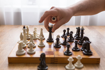 Dad and Son playing chess together at home