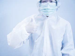 Woman nurse wearing mask raises the thumbs up to compliment people who work at home and social...