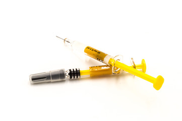 Two syringes close up isolated