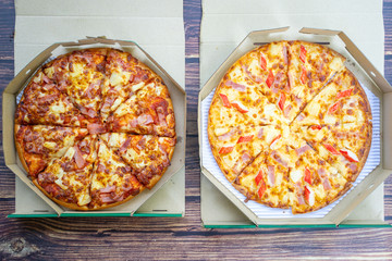 two pizza in boxes for take away