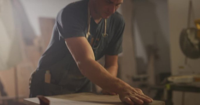 Woodworker men working in garage