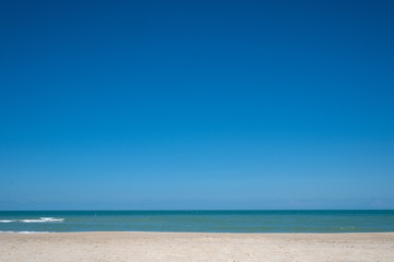 Fototapeta na wymiar Dark blue sky on the sand beach, Thailand