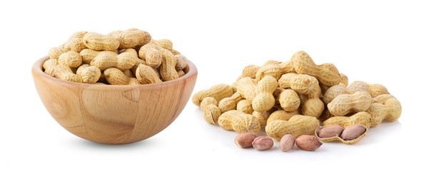 peanuts in wood bowl isolated on white background