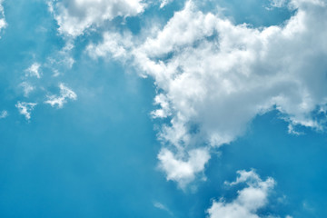 Fototapeta premium Blue sky blackground with flare cloud in the clear day