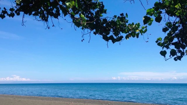 Blue Sunny Day Scenery Of Tropical Fishing Beach Atmosphere Under The Shade Tree Of Portia Tree Or Thespesia Populnea On The Beach