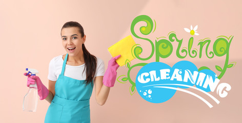 Female janitor with supplies on color background. Spring cleaning