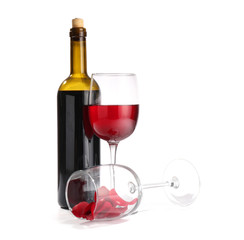 Glasses and bottle of wine on white background