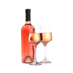 Glasses and bottle of wine on white background