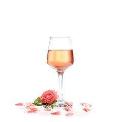 Glass of wine with rose flower on white background