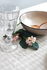  tableware on the festive table, close-up. glass cup and spoon on the table.