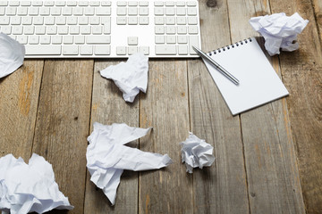 home office breakdown, keypad and crumpled paper balls