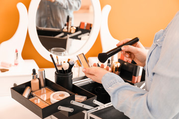 Makeup artist at workplace in beauty salon