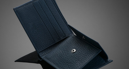 Fashionable leather men's wallet on a dark background