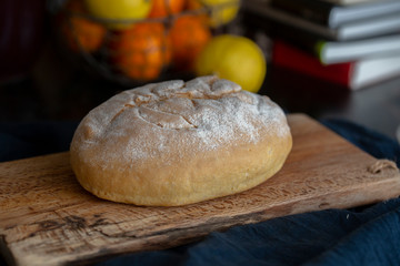 homemade artisanal wholewheat bread on cutting board