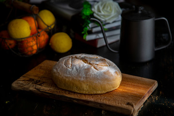 homemade artisanal wholewheat bread on cutting board