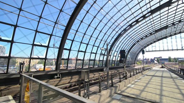 BERLIN, GERMANY - MAY 27, 2017: Train arriving and other departing on Berlin Hauptbahnhof at the same time