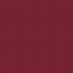 Seamless pattern of small triangles floating on a rusty red background