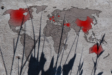 Coronavirus distribution map on concrete dark background