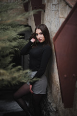 Obraz premium Street urban shooting. Girl on a textured background in the city