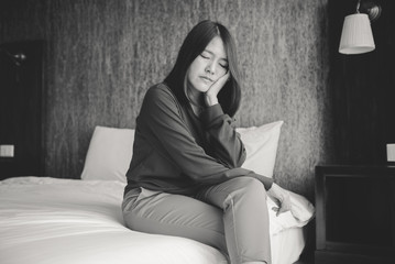 Depressed asian woman sitting in bedroom,Mental disorder health care,World suicide prevention day...