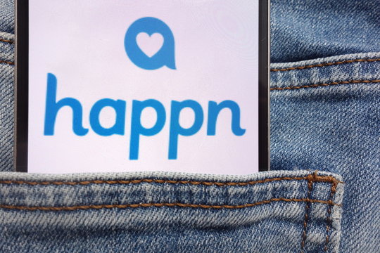 KONSKIE, POLAND - JUNE 12, 2018: Happn logo displayed on smartphone hidden in jeans pocket